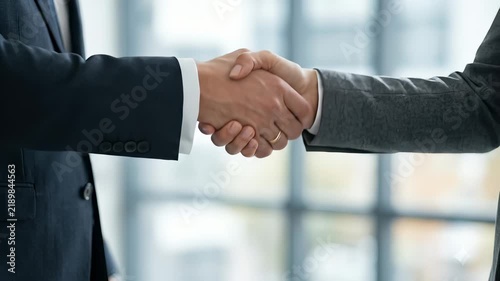 Close Up of Business Partners Shaking Hands to Seal a Deal
