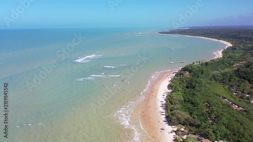 Fantastic aerial view of Nativos Beach with white sand, coconut trees and tropical nature in Trancoso, Bahia, Brazil