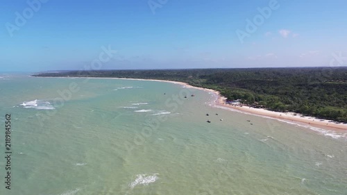 Fantastic aerial view of Nativos Beach with white sand, coconut trees and tropical nature in Trancoso, Bahia, Brazil
