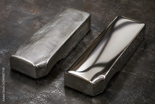 Finished polishing job showing mirror smooth metal sample against unfinished rough counterpart dark studio background
