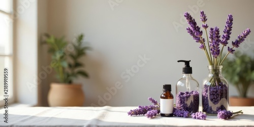 Scented Lavender Essential Oils and Soaps in Glass Bottles on a Tabletop Near a Window with Sunlight