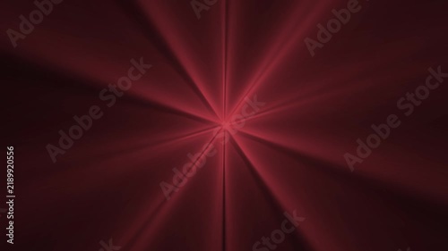 Radiant red light beams emanate from a central point creating a symmetric starburst pattern in this dynamic digital motion video footage for modern abstract visual backgrounds