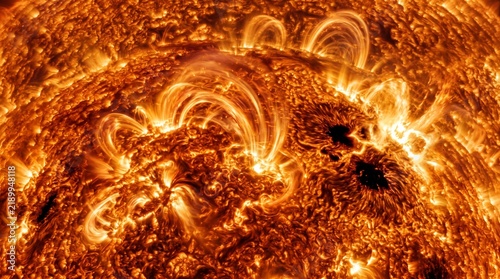 Close-up View of Powerful Solar Flares and Magnetic Plasma Loops Erupting on the Active Surface of the Sun
