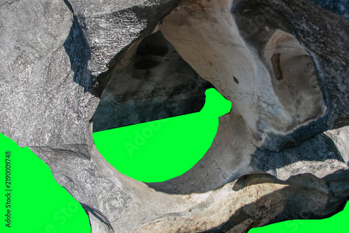 Cuadro en lienzo Unique karst rock formation, rough texture, and blackish-gray surface color set against a green background—suitable as a 3D digital imaging asset