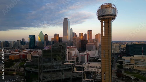 Aerial close up view of Reunion tower with the Dallas Texas skyline at sunset.