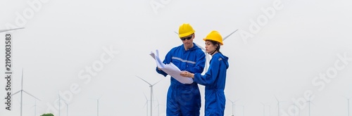 Konstfotografi Engineers Team inspecting wind turbine power generator sustainability performanc