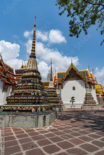фотографія Courtyard with multiple ceramic chedi stupas at Wat Pho temple