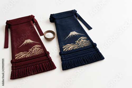 Sumo ceremonial aprons with salt dish, tradition and ritual concept