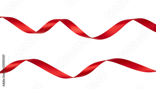 Isolated on a white background, this red satin ribbon bow with curls is an ideal decorative element for Christmas greeting cards.