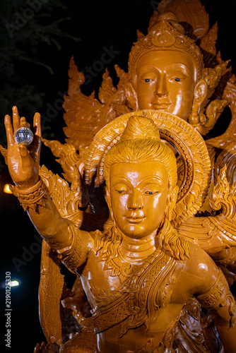 Buddhist Lent tradition, a beautiful display of wisdom, beeswax candles create art as a Buddhist offering.Background with Thai pattern carved on the surface of Lent candle.Ubon Ratchathani.Festival