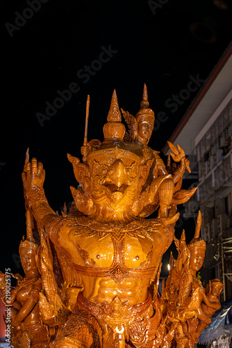 Buddhist Lent tradition, a beautiful display of wisdom, beeswax candles create art as a Buddhist offering.Background with Thai pattern carved on the surface of Lent candle.Ubon Ratchathani.Festival