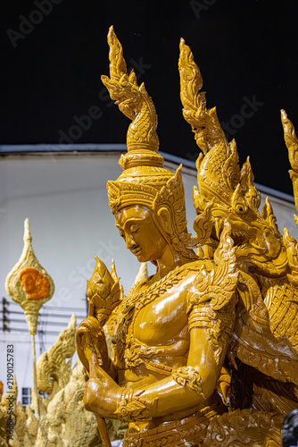Buddhist Lent tradition, a beautiful display of wisdom, beeswax candles create art as a Buddhist offering.Background with Thai pattern carved on the surface of Lent candle.Ubon Ratchathani.Festival
