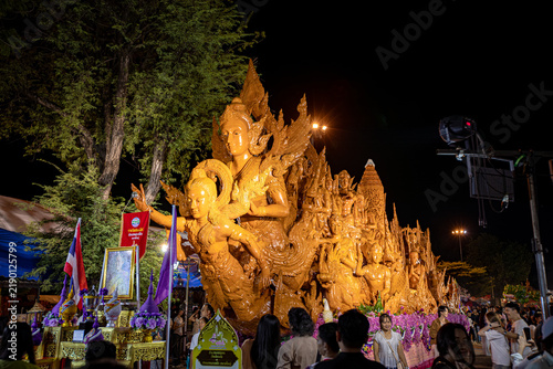 Buddhist Lent tradition, a beautiful display of wisdom, beeswax candles create art as a Buddhist offering.Background with Thai pattern carved on the surface of Lent candle.Ubon Ratchathani.Festival