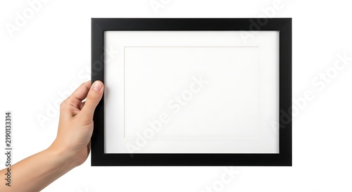 Hand holding an empty black picture frame against white background