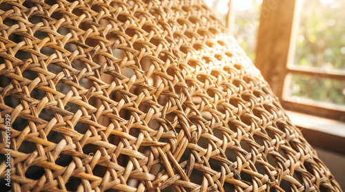 Obraz na płótnie Woven rattan or wicker texture background with warm light.