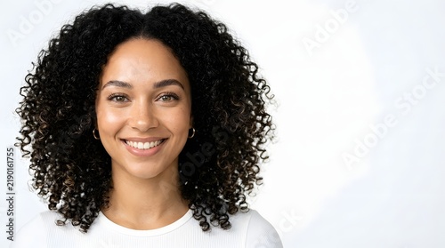 Smiling African American Woman with Curly Hair and Joyful Expression, Young Black Female Model Portrait Celebrating Beauty, Happiness and Natural Confidence