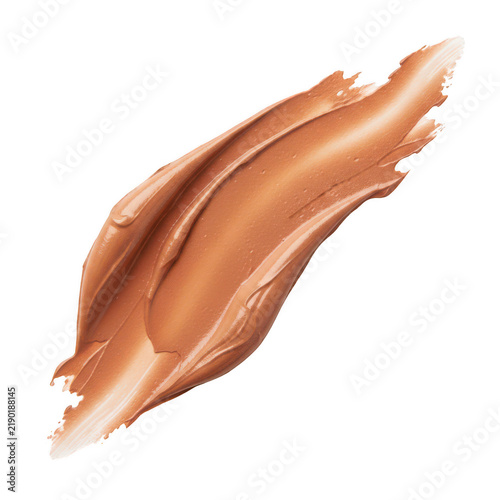 A smooth brown makeup foundation cream smear or lotion texture stroke on a beauty skin care cosmetic sample