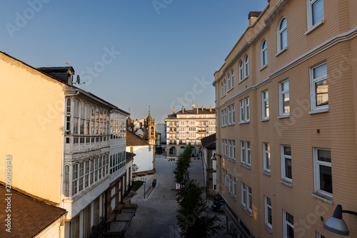 Foto Historic City Street with Traditional Glazed Balconies, Lugo, Spain