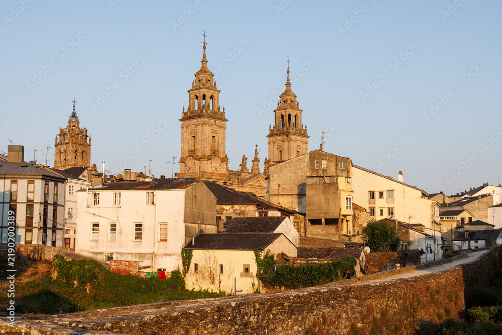 Obraz premium Historic Cityscape with Cathedral Towers and Roman Wall, Lugo, Spain