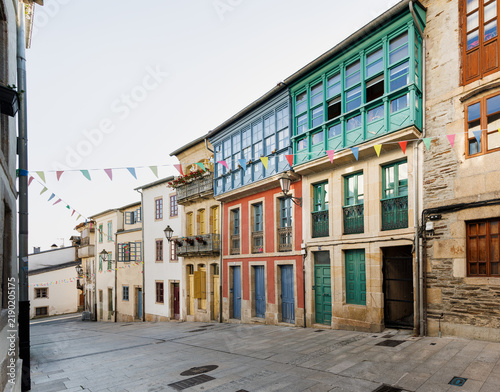 Bild auf Leinwand Colorful Historic Street with Traditional Balconies, Lugo, Spain