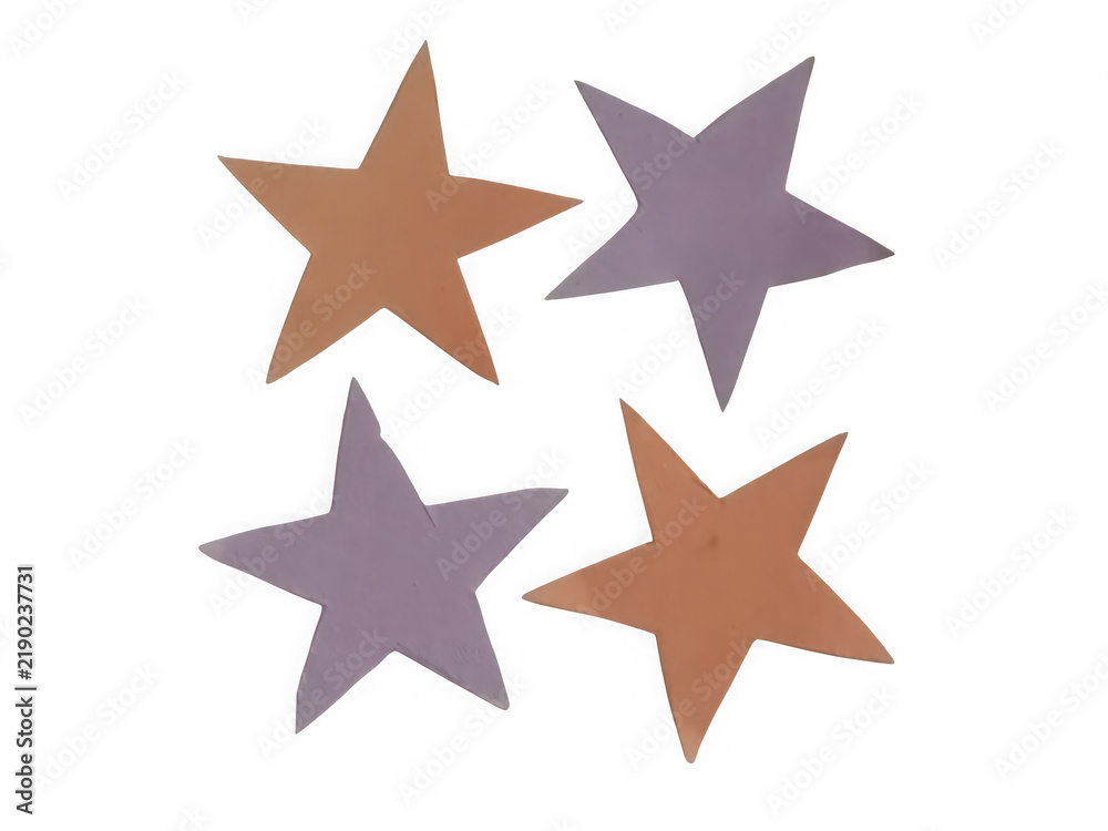 Obraz premium Four colorful paper stars isolated on a clean white background for creative design projects