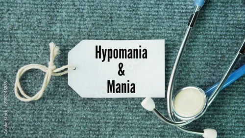 Фотография Stethoscope and paper tags with the words Hypomania and mania