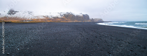 Fotografie Panoramic View of Black Sand Beach Vikurfjara with Snow Covered Mountains, Vik i