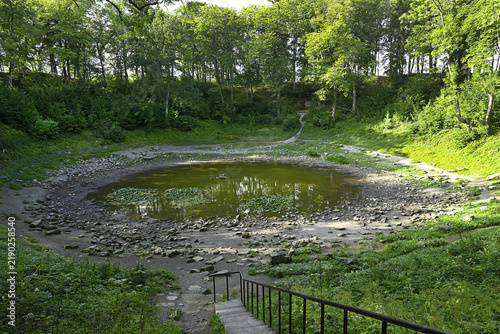 The largest impact crater at Kaali on the Estonian island of Saaremaa, formed by a meteorite impact. The explosion that created the crater occurred approximately 660 ± 85 BC.
