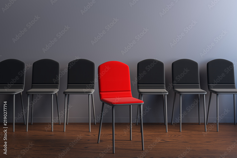 Obraz premium Red spotlight chair standing apart from a row of black seats in a modern interior, symbolizing career choice, hiring, and business opportunity. 3D Rendering