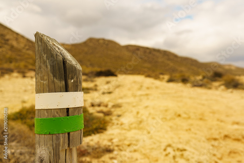 White green trail sign