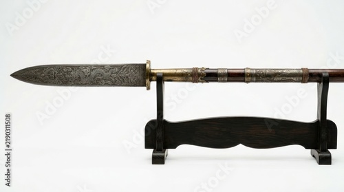 Ornate spear head displayed on a stand