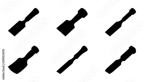 Fotografie Six black silhouette chisels on a clean white background