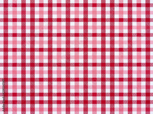 Vibrant red and white checkered tablecloth pattern featuring classic picnic gingham fabric texture