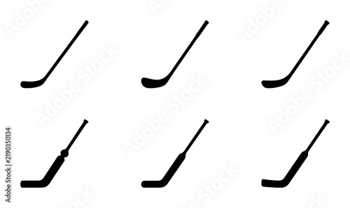 Canvas Print Black hockey stick silhouettes on white background, sports equipment