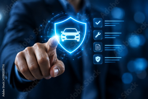 Hand touching illuminated shield icon with car silhouette and associated controls