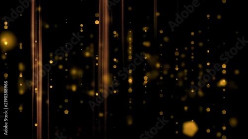 Golden abstract background with falling particles and glowing light rays