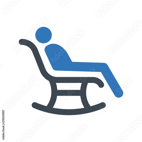 Person relaxing in a rocking chair during a moment of leisure and comfort