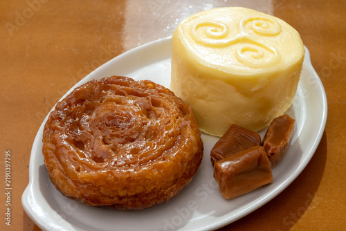 Food of Brittany, hand-made farm salted butter, Kouign-amann legendary Breton confection, caramel with butter, authentic Breton food with centuries-old tradition