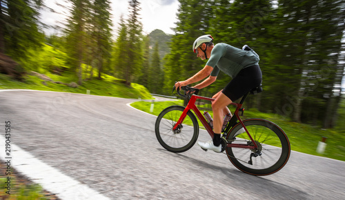 Road Cyclist Riding on Mountain Road in Italian Dolomites