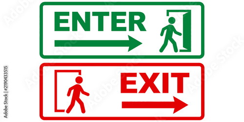 Green enter and red exit rectangular signs with walking man symbol.