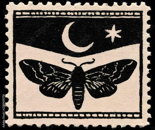 Vintage Halloween-themed paper postage stamp featuring a moth silhouette. An antique scrapbook marker with a crescent moon and star, perfect for journaling and collaging