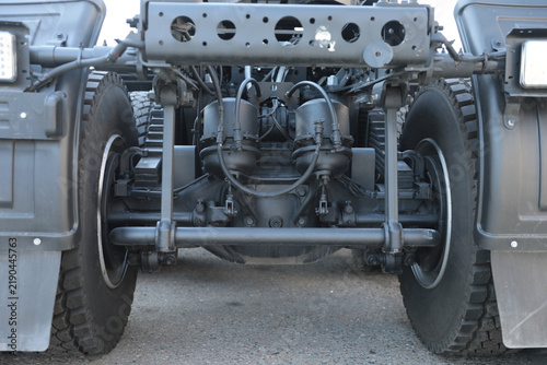 Mechanical parts on the rear suspension of a truck.