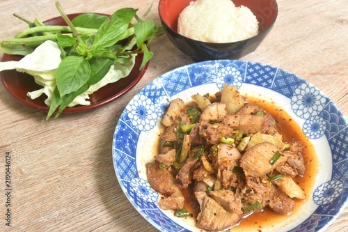 Thai spicy slice beef meat salad on plate eat couple fresh basil and sticky rice