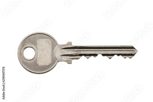 A single metallic door key with a circular head and serrated blade for opening locks and securing entryways isolated on a transparent background