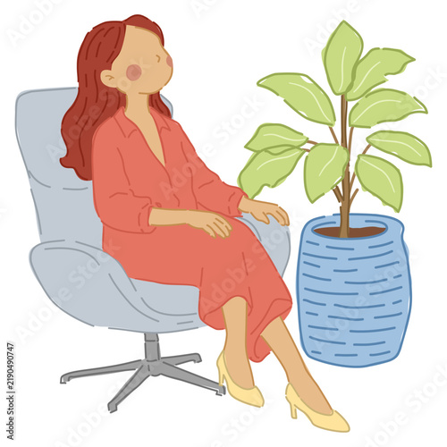 Woman resting comfortably in an armchair beside a large potted plant, creating a calm and cozy indoor relaxation scene.