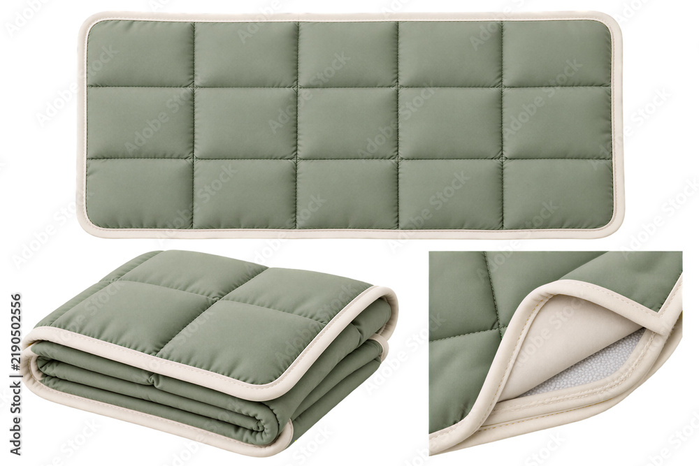 Fototapeta premium Quilted sage green rectangular pad with cream edges, folded view showing thick padding layer, isolated on transparent background. Bedding, nursery accessory, home textile.