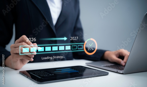 Business strategy concept showing professional planning with 2026 to 2027 timeline progress indicator and 95 percent completion on digital devices for future growth planning and success