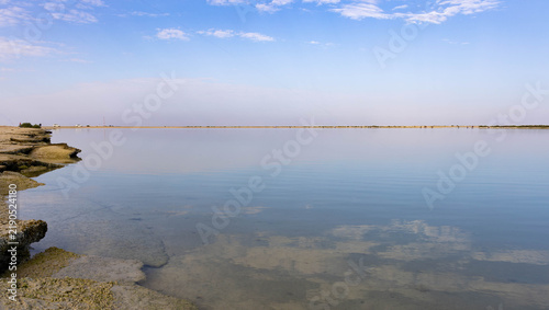 Canvastavla Tranquil Coastal Lagoon with Blue Sky and Reflections