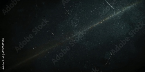 Dark cinematic film grain texture with dust particles and light scratches for vintage video overlay effect