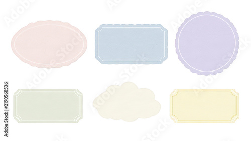 Set of six colorful blank paper labels with decorative borders on white